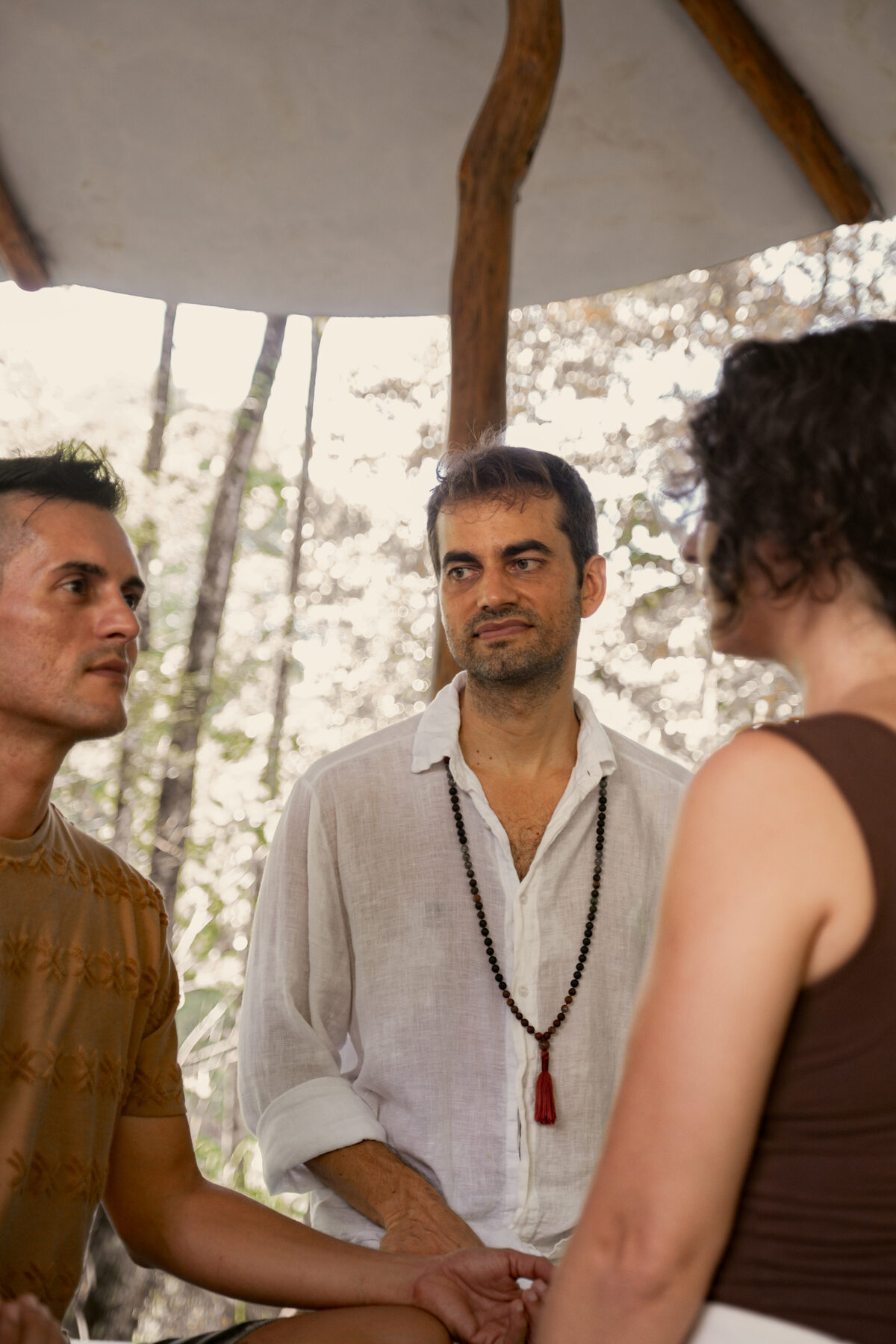 David Brundige listening, seated beside a client